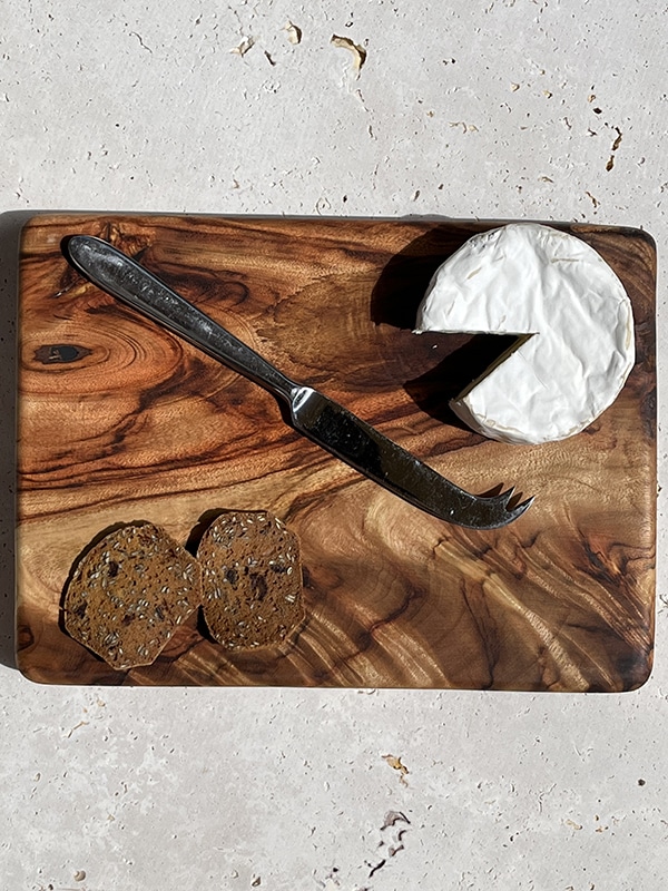 Cheese and crackers on a cutting board