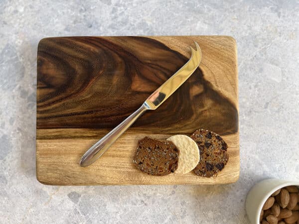 Knife and crackers on a cutting board