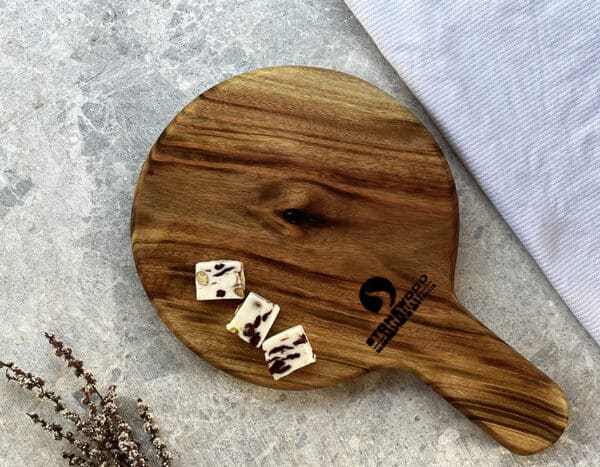 Stonewood round cheese board with Cheese on it