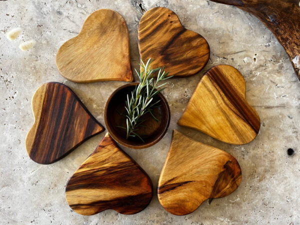 Heart Shaped Coasters of Wood Aligned in Round Way